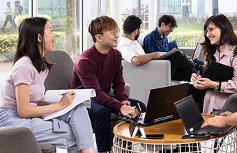 Student having a conversation at the student lounge.