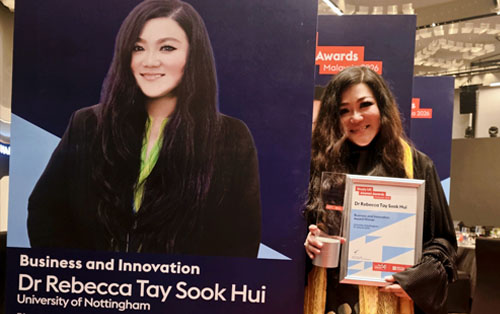 article-rebecca-tay-with-poster