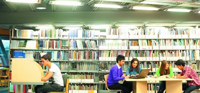 Undergraduate and postgraduate students studying in the Learning Resource Centre at the Jubilee Campus UK