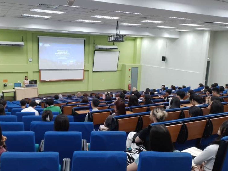 University induction week with new students engaging in campus activities.