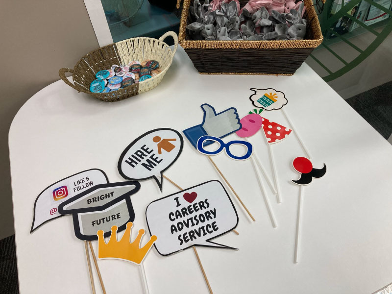 Colorful props arranged for the induction week photo booth.