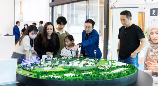 tile-fsc-main-programme-counsellor-showing-students-campus-scale-model
