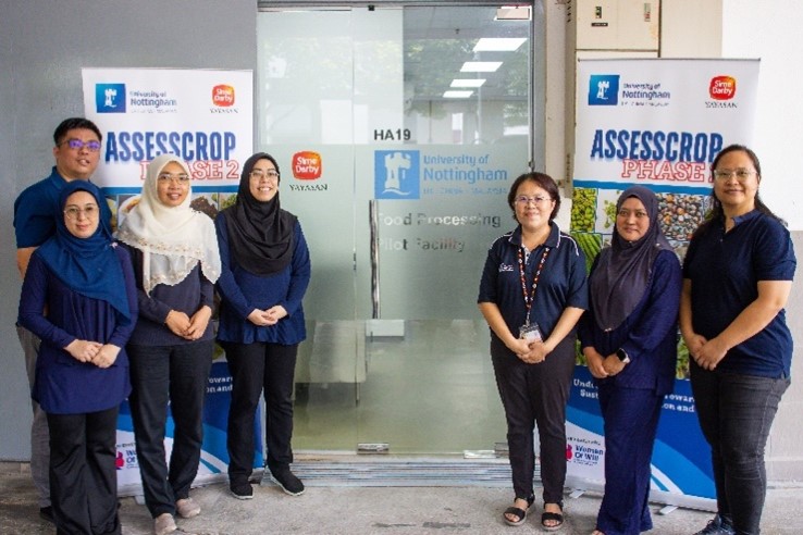 Third from right - Dr. Lim Yin Sze and her research team standing infront of the Food Processing Pilot Facility.)