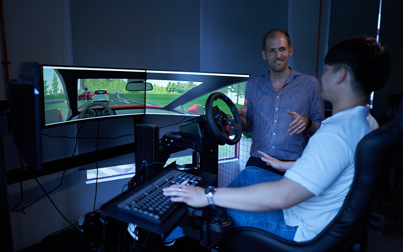 Student showcasing his work to the supervisor