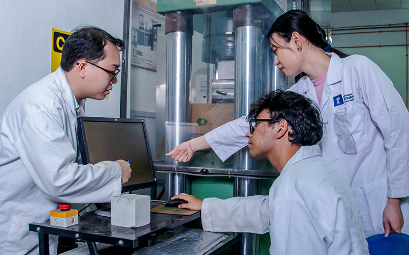 Students discussing with their lecturer