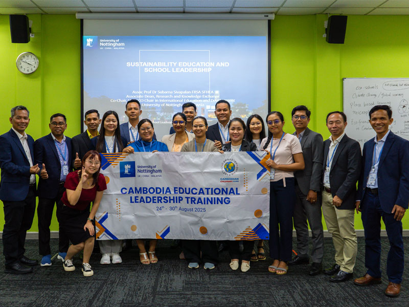 cambodia participant with banner