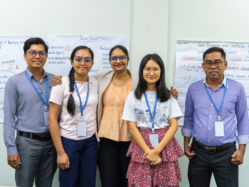 Dr Subha with participant in classroom